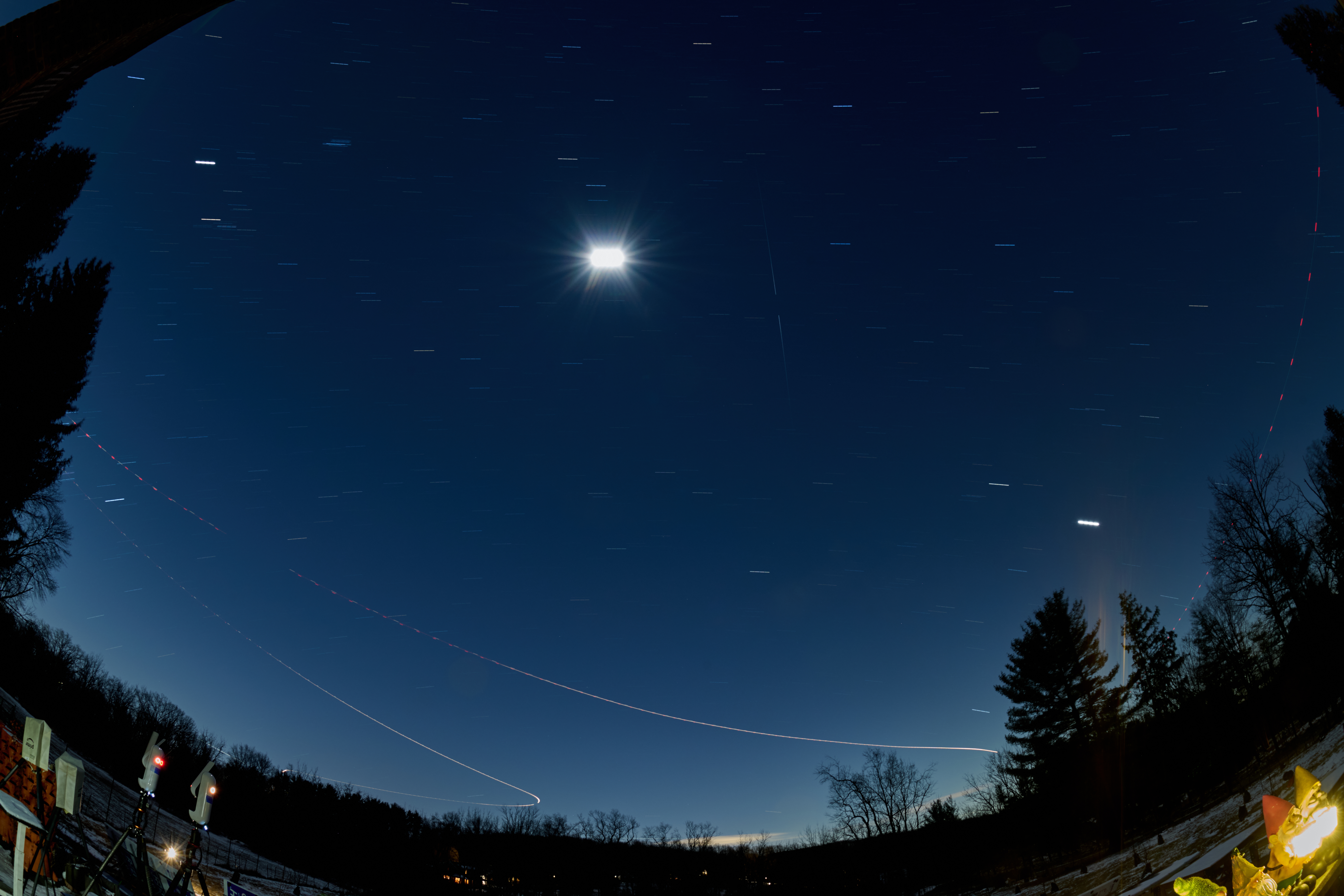 Winter Night Sky Star Trails (with a meteor trail) Over New Jersey. Composite of images taken with a Nikon Z9 camera and 8-15 mm fisheye lens.