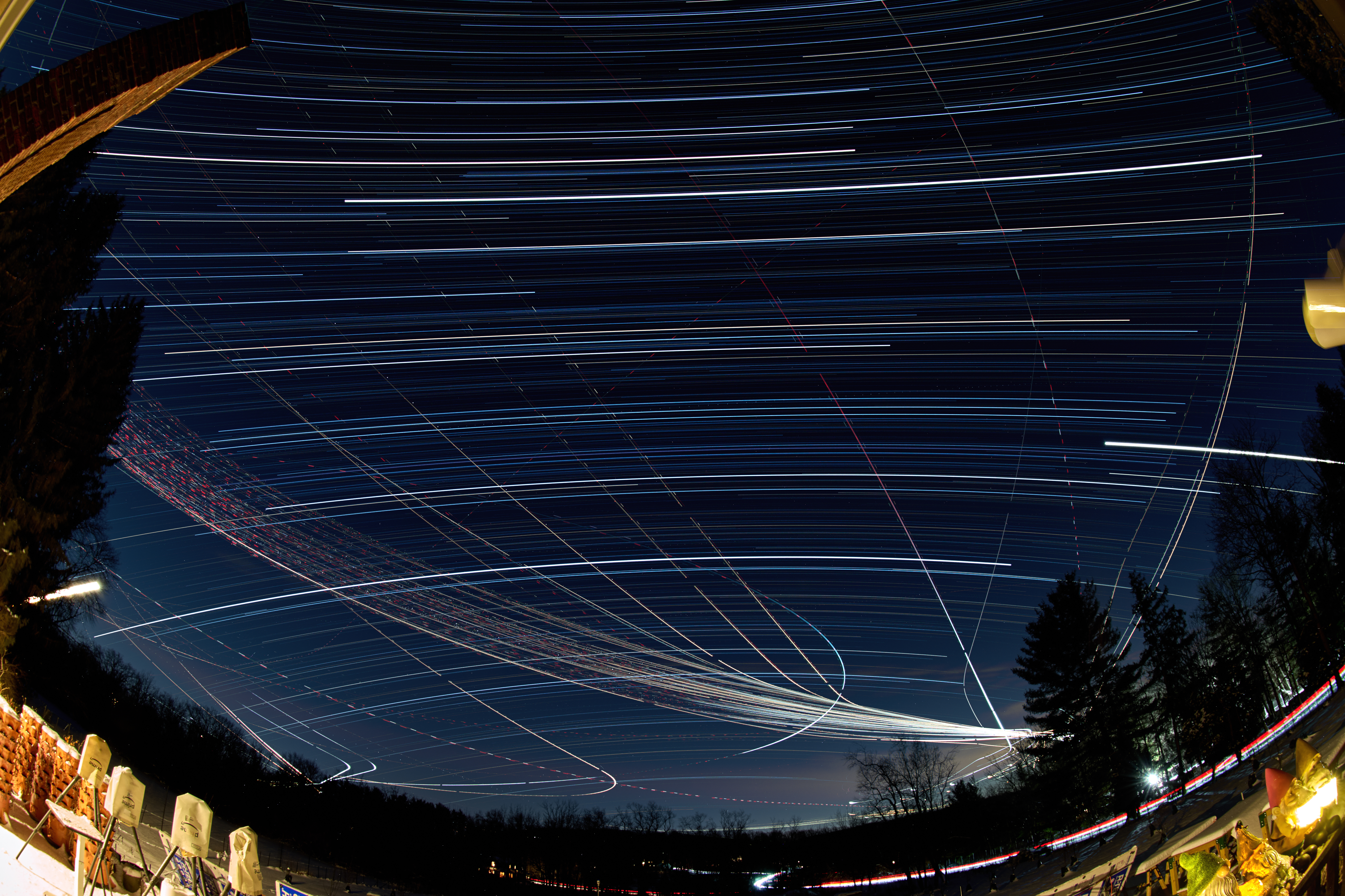 Winter Night Sky Star Trails Over New Jersey. Composite of images taken with a Nikon Z9 camera and 8-15 mm fisheye lens.